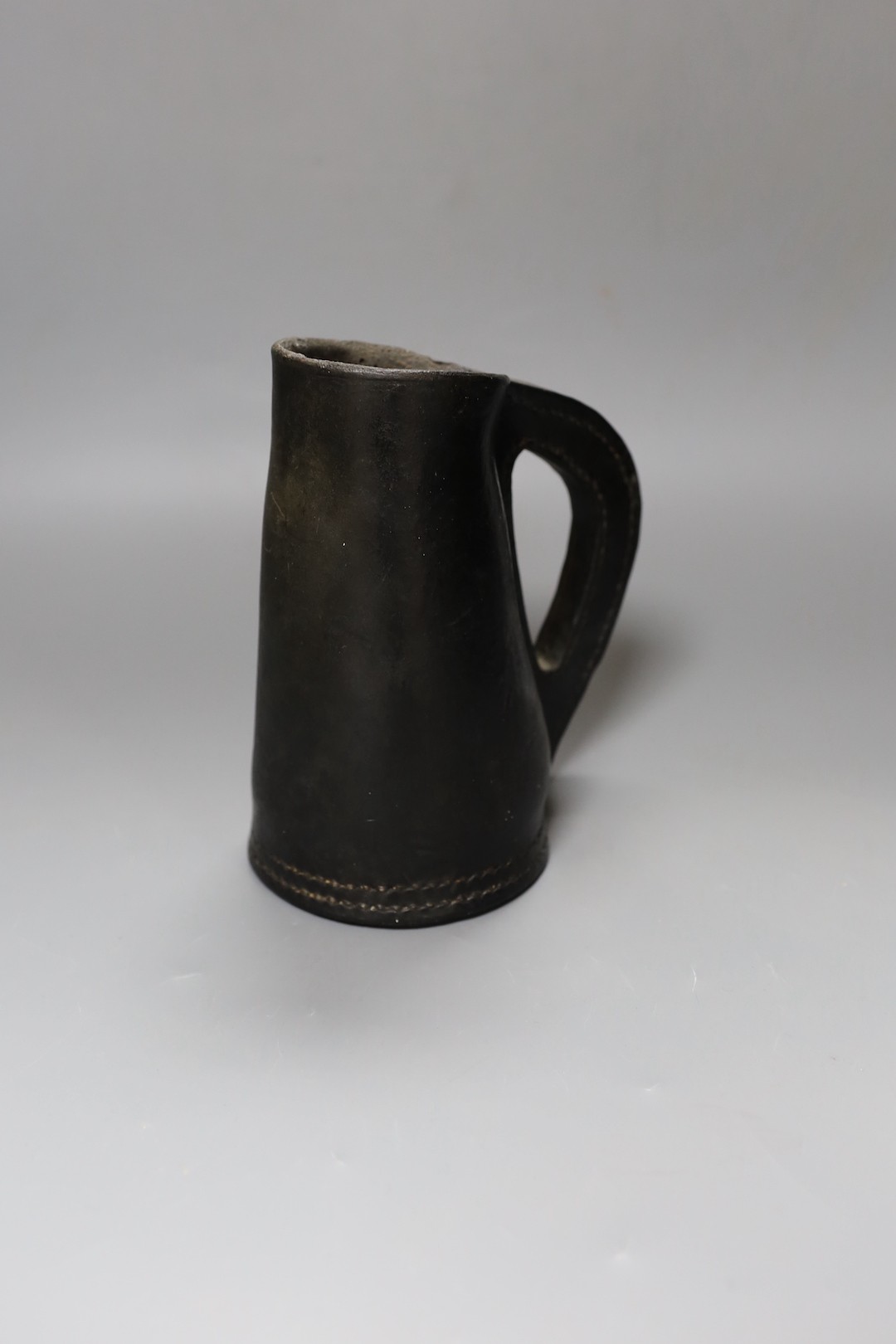 A Leather blackjack jug, 19.5 cms high.